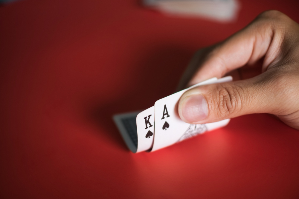 blackjack-cards-hands-red-table (2)